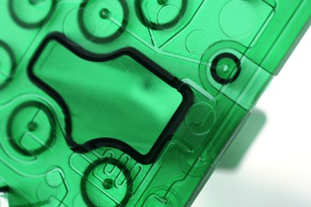 translucent green microfluidic cartridge